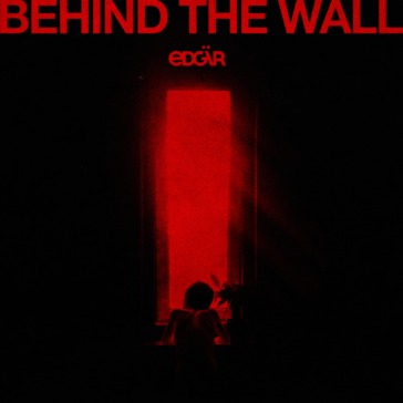 Behind the wall